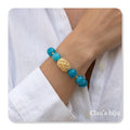 Pulseira com pedras turquesa com peça banhada a ouro