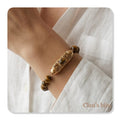 Pulseira com pedras olho de tigre com peças em aço