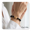 Pulseira com pedras ónix com peça banhada a ouro