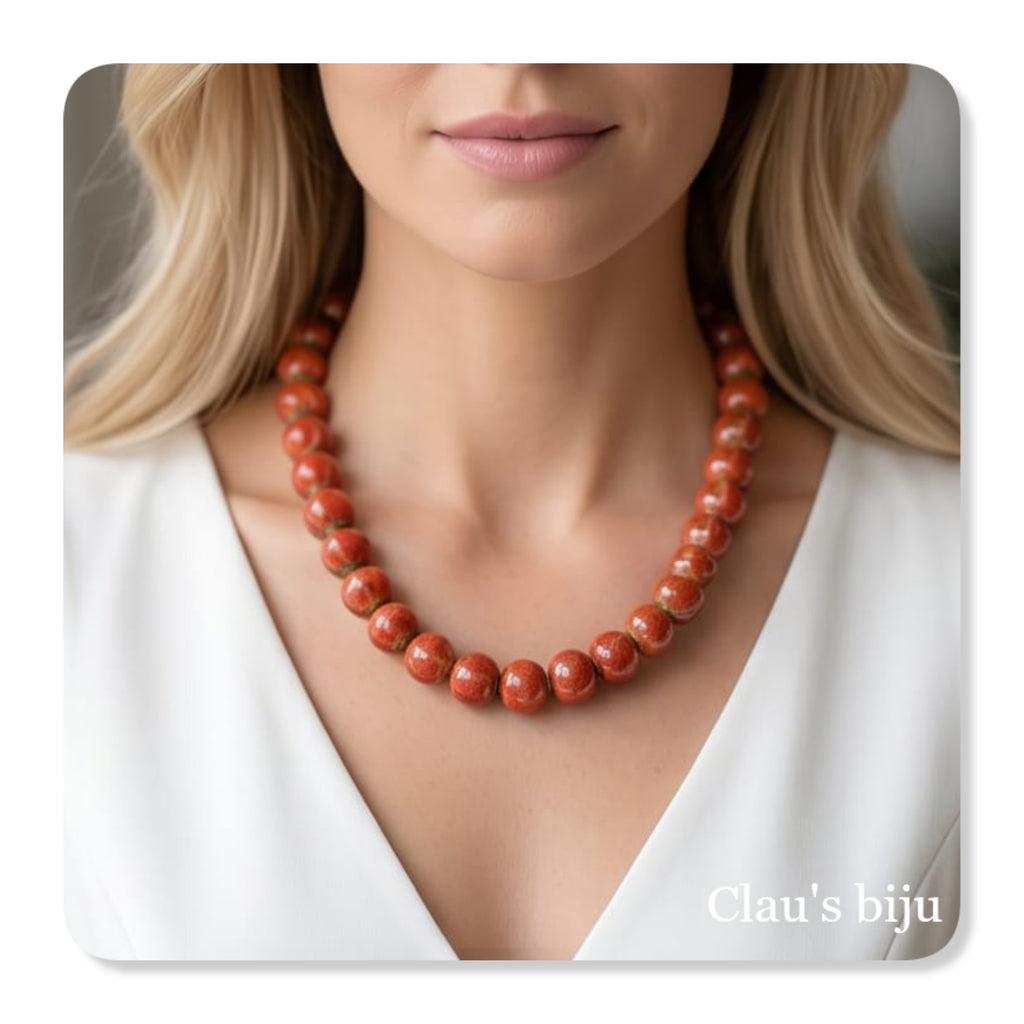 Pulseiras com peças em cerâmica alaranjadas