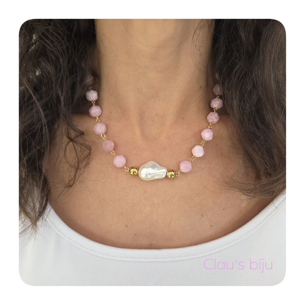 Necklace with pink stones and steel pieces.