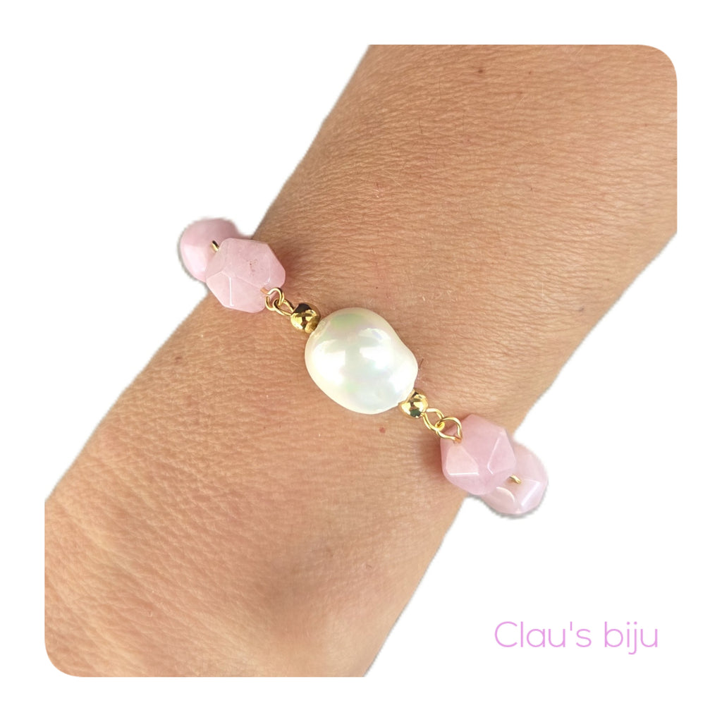 Necklace with pink stones and steel pieces.