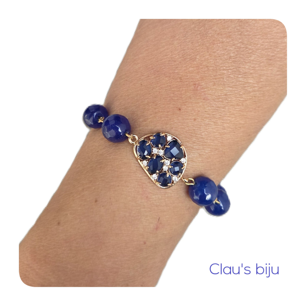 Necklace with blue stones and steel pieces.