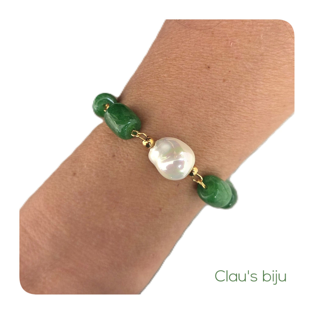 Bracelet with green stones and steel components.