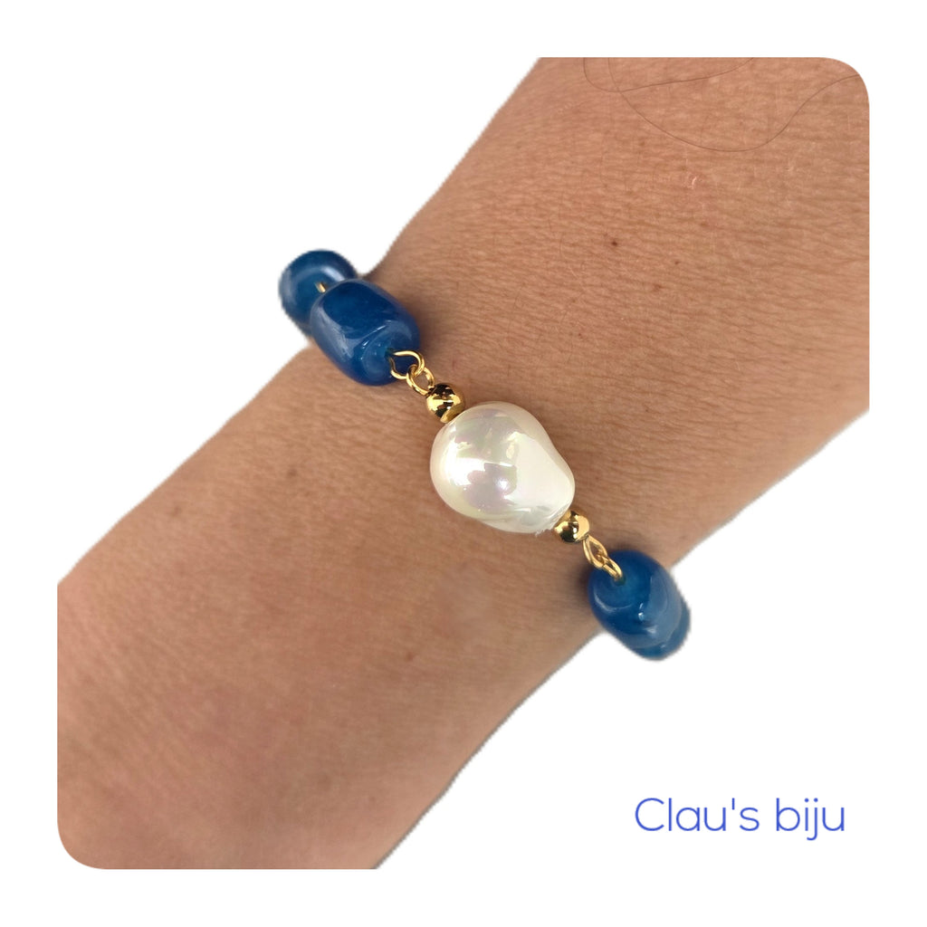 Bracelet with blue stones and steel pieces.