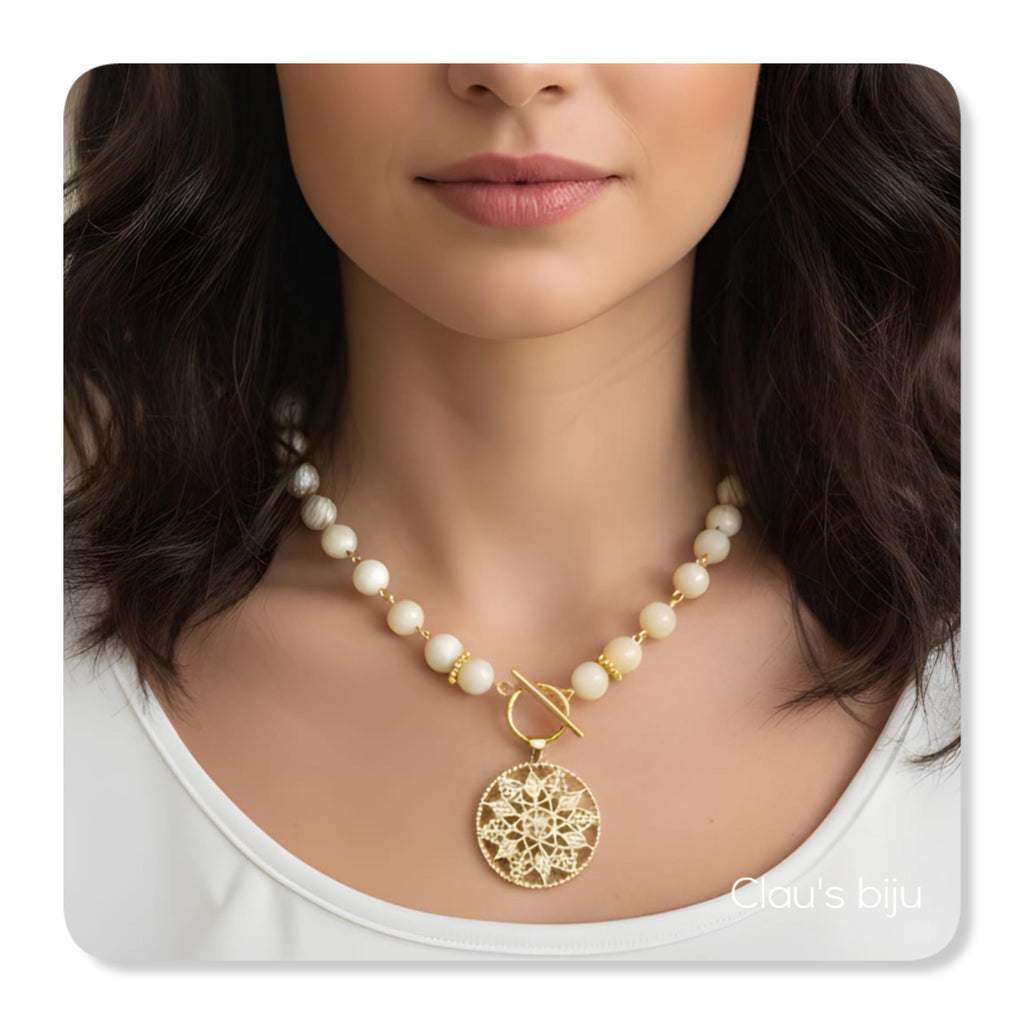 Mother-of-pearl bracelets with 18-karat gold-plated pieces.