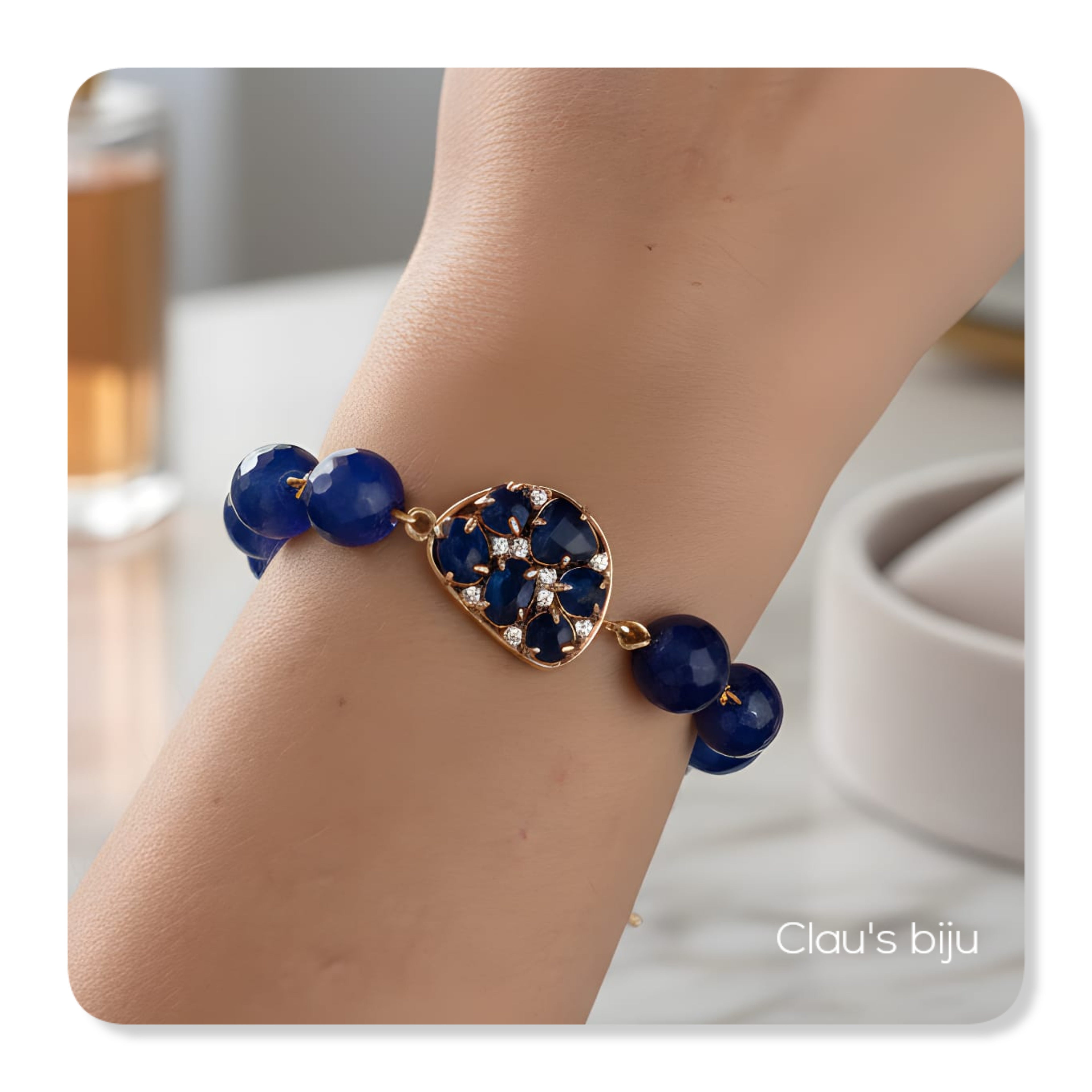 Bracelet with blue stones and steel pieces.