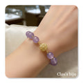 Pulseira com pedras lilás e peça banhada a ouro