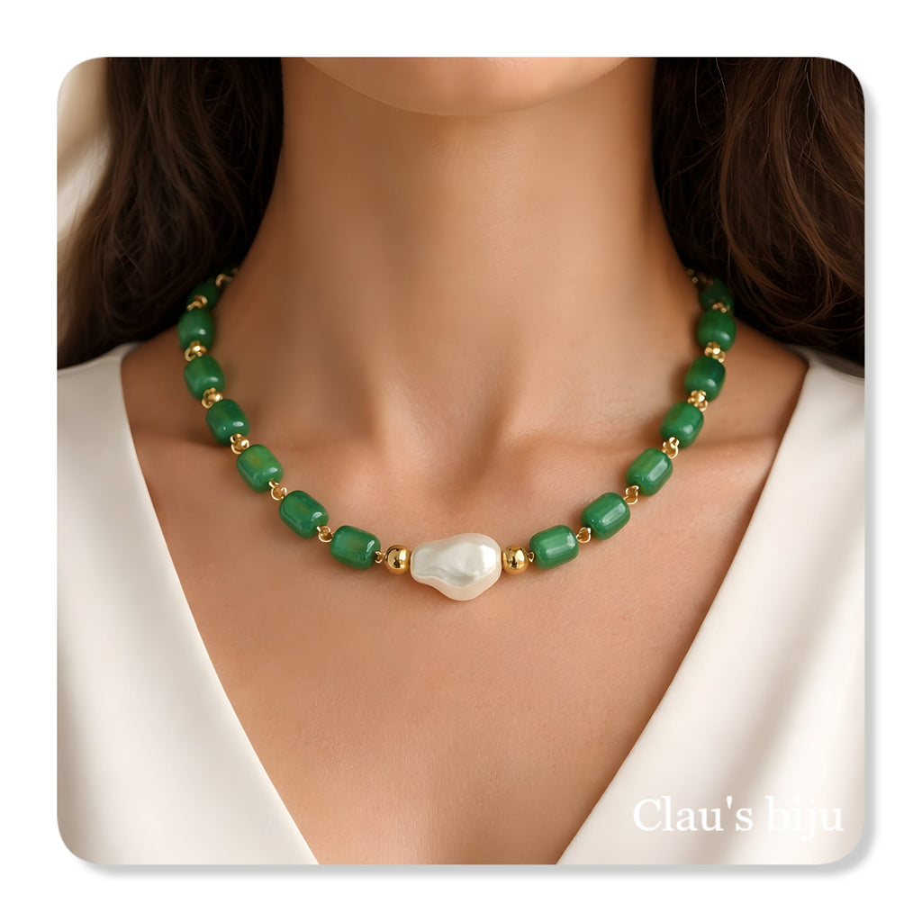 Bracelet with green stones and steel components.