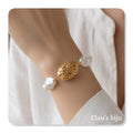 Pearl bracelet with gold-plated detail.
