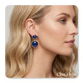 Earrings with blue stone, plated in 18 karat gold.